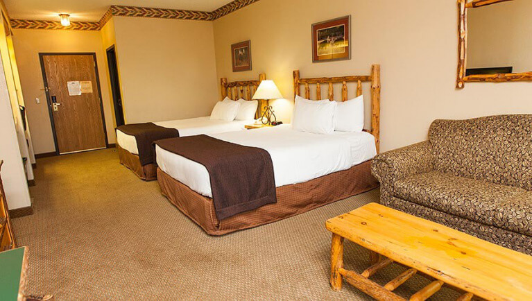 Queen beds and sofa in the Double Queen Sofa Suite (Balcony/Patio)